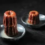 Caneles de Bordeaux, Traditional French Sweet Dessert on Black Table